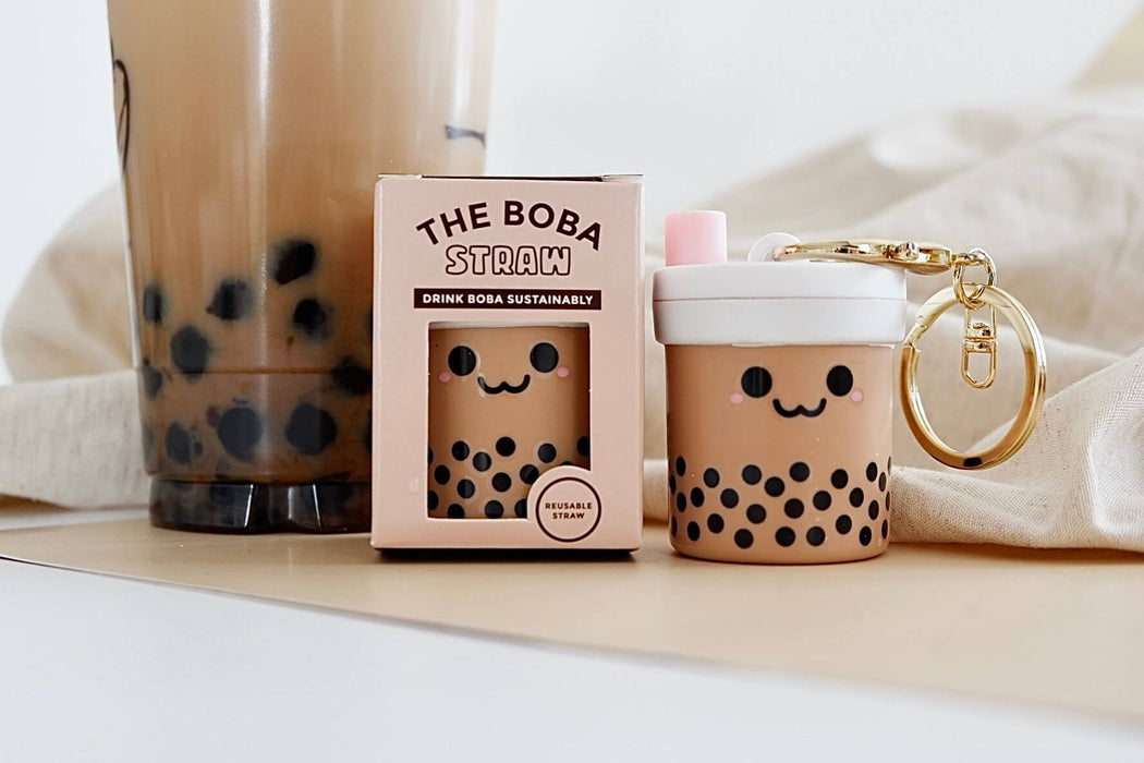 Boba Tribe cute bubble tea keychain silicone straw holder. Poke a hole cap and roll up ziplock silicone straw in a keychain case. Reusable, portable, sustainable.