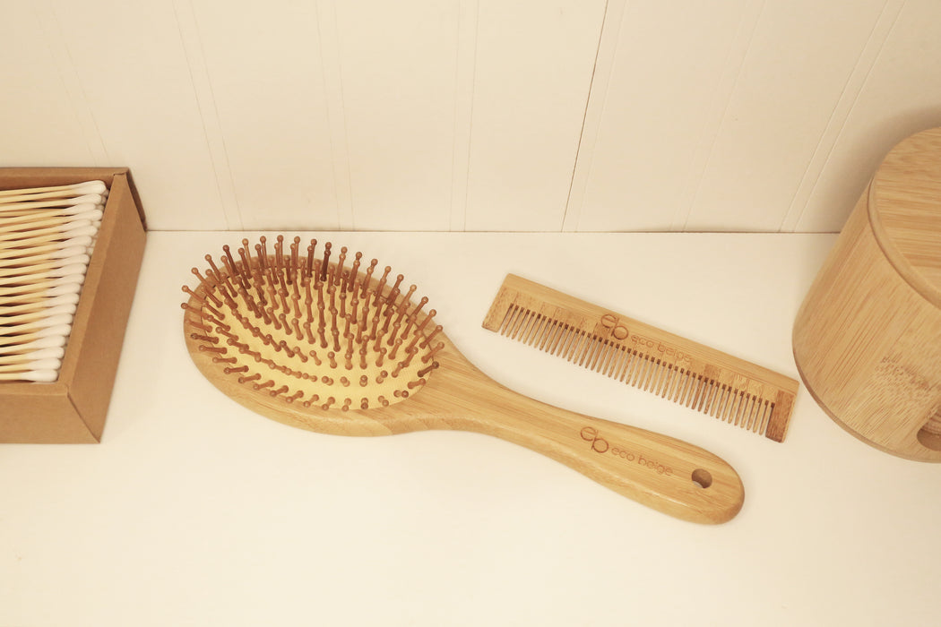 Eco Beige bamboo comb and bamboo cushioned brush in an eco-friendly bathroom.