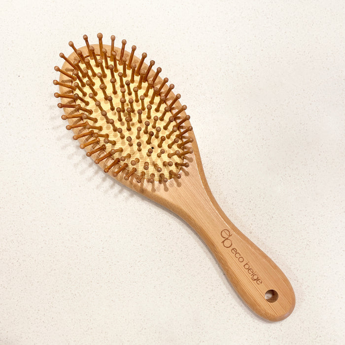 Cushioned Bamboo Hair Brush is made with our planet in mind. The handle and brush bristles are all made of bamboo. The cushion is also made of natural rubber. A comb like this is the perfect size for smaller volume of hair while massaging scalp at the same time!