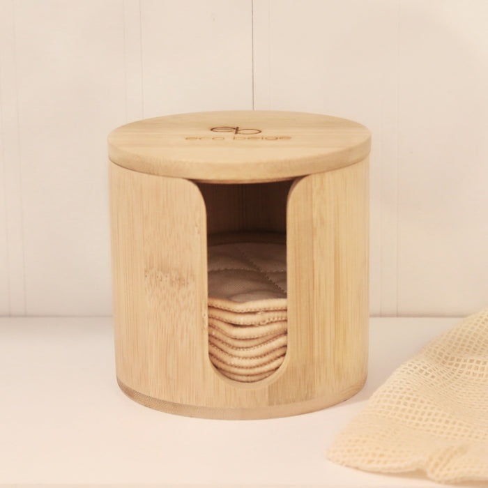 Cylinder shape bamboo case with reusable cotton rounds inside.