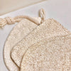 Eco Beige natural loofah scrubs set of 3 with shapes: Oval, Rectangle, Droplet. Close up texture view.