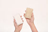 Eco Beige natural and fully compostable dish sponge made with wood cellulose fiber and loofah plant fiber. Hand held with different sides facing the front view.