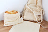Cotton bulk food bag holding pastry goods side along with other natural cotton bag display