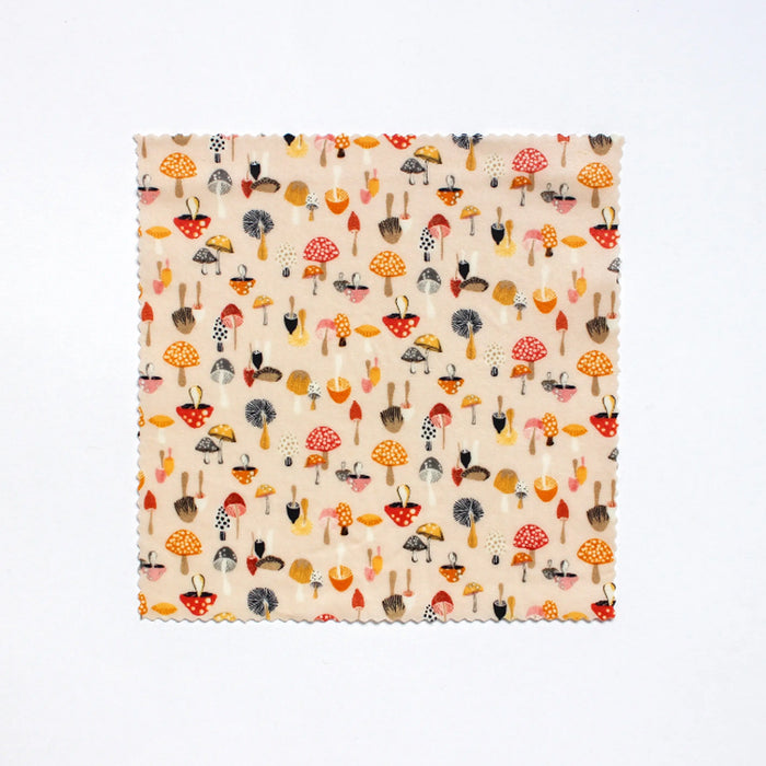 Mushroom print beeswax food wrap in single medium 10"x10" size.