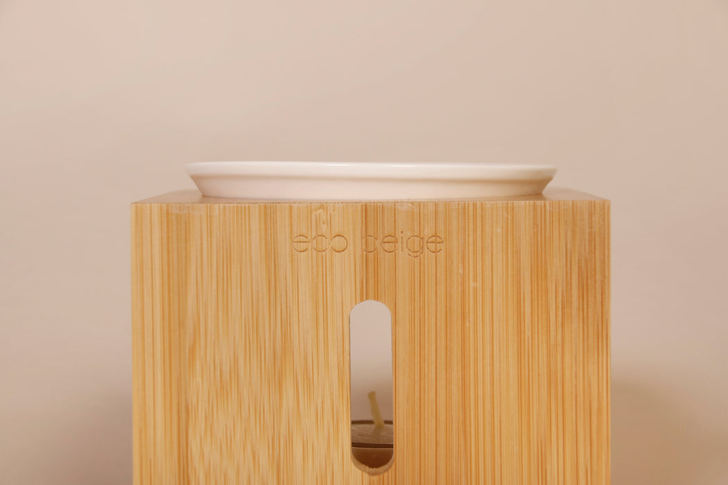Eco Beige bamboo wax warmer stand with removable metlilng dish and ceramic tea-light holder. Engraved logo at the back.