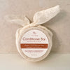 Eco Beige cream color conditioner bar in eucalyptus peppermint scent.Wrapped in cotton gauze. Locally made in Vancouver.