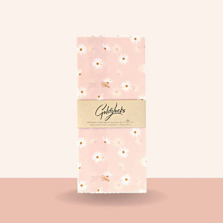 Pastel pink daisy print beeswax food wrap in single medium.