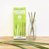 EQUO grass drinking straws in green box and 3 straws inside a glass bottle. Made with Grass, 100% natural and compostable.