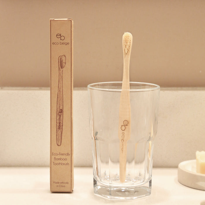 Eco-friendly bamboo toothbrush with Eco Beige engraved.  Kraft box packaging with toothbrush sketch illustration.