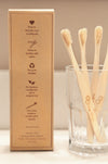 Eco-friendly bamboo toothbrush with Eco Beige engraved. Kraft box packaging with recycle instruction illustrated at the back.