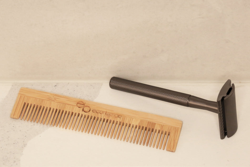 Eco Beige travel size bamboo comb with black gold safety razor in the minimalist background.
