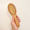 Cushioned Bamboo Hair Brush is made with our planet in mind. The handle and brush bristles are all made of bamboo. The cushion is also made of natural rubber. A comb like this is the perfect size for smaller volume of hair while massaging scalp at the same time!