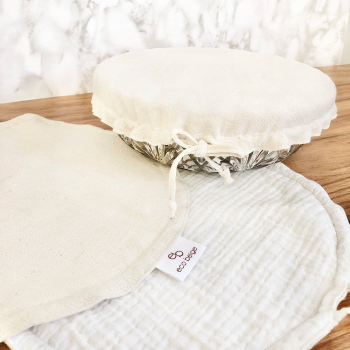Eco Beige handmade linen cover for bowls. Lined with cotton gauze fabric on the inside, and sewn with Eco Beige logo tag and elastic-free drawstring.