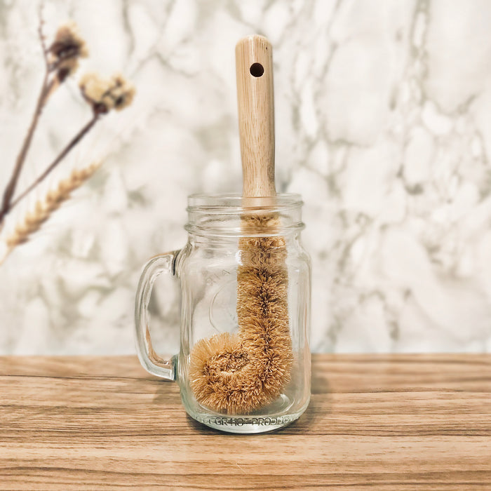 Eco Beige curved natural coconut bottle brush with wood handle. Used for cleaning bottles.