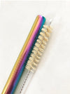 Multicolor stainless steel boba straw with natural sisal straw brush set in white background.