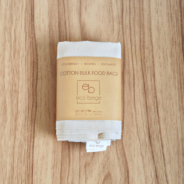Set of 3 cotton bulk food bags wrapped in a kraft paper sleeve.