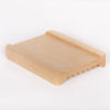Natural bamboo soap dish with white background. Features reversible sides, with flat side facing up, and ridged side facing down.