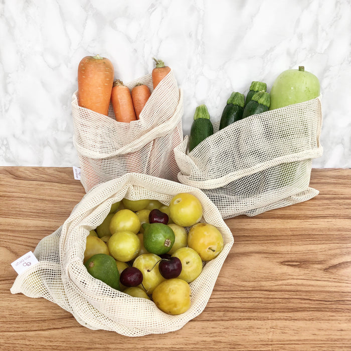 Eco Beige Natural Produce Bags set of 3 holding fresh fruits and veggies. Sizes: 25x30cm/30x32cm/32x40cm