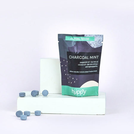 Huppy Natural toothpaste tablet charcoal mint refill made with clean ingredients and compostable packaging bag. 
