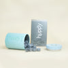 Huppy natural toothpaste tablets charcoal mint flavour inside blue Huppy aluminum container.