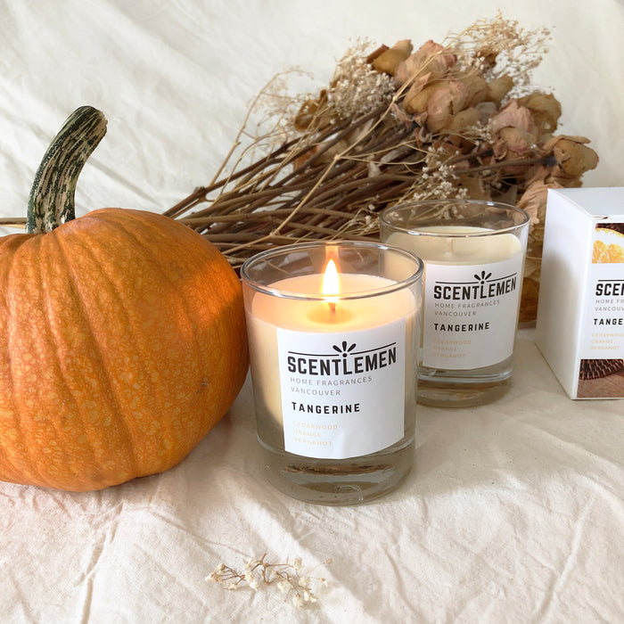 Scentlemen Studio hand poured soy wax tangerine scent candle in a glass container. Decorated with Autumn theme with pumpkin and dried roses. 