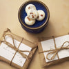Scentlemen Studio Winter Memory soy wax melts comes in a package of 9 in paper gift wrap.